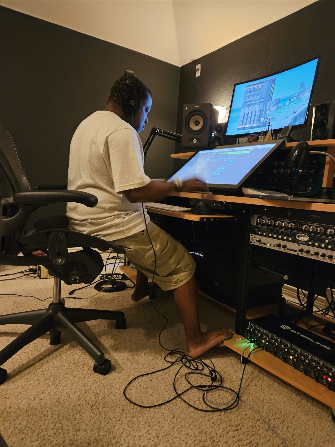 A Corinthians creative working at a studio desk